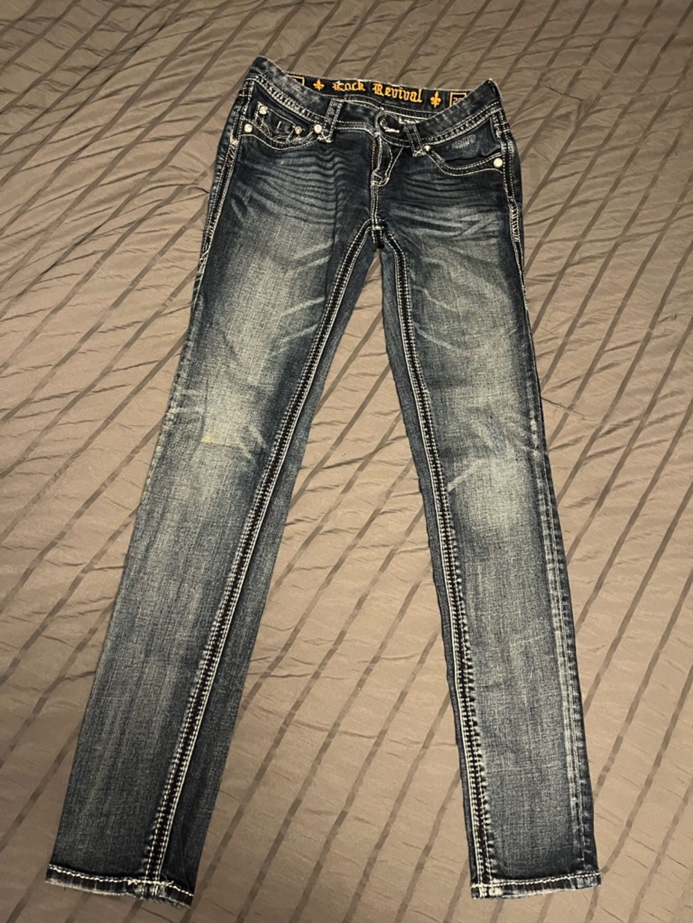Rock Revival Skinny Jeans in Distressed Dark Blue Denim